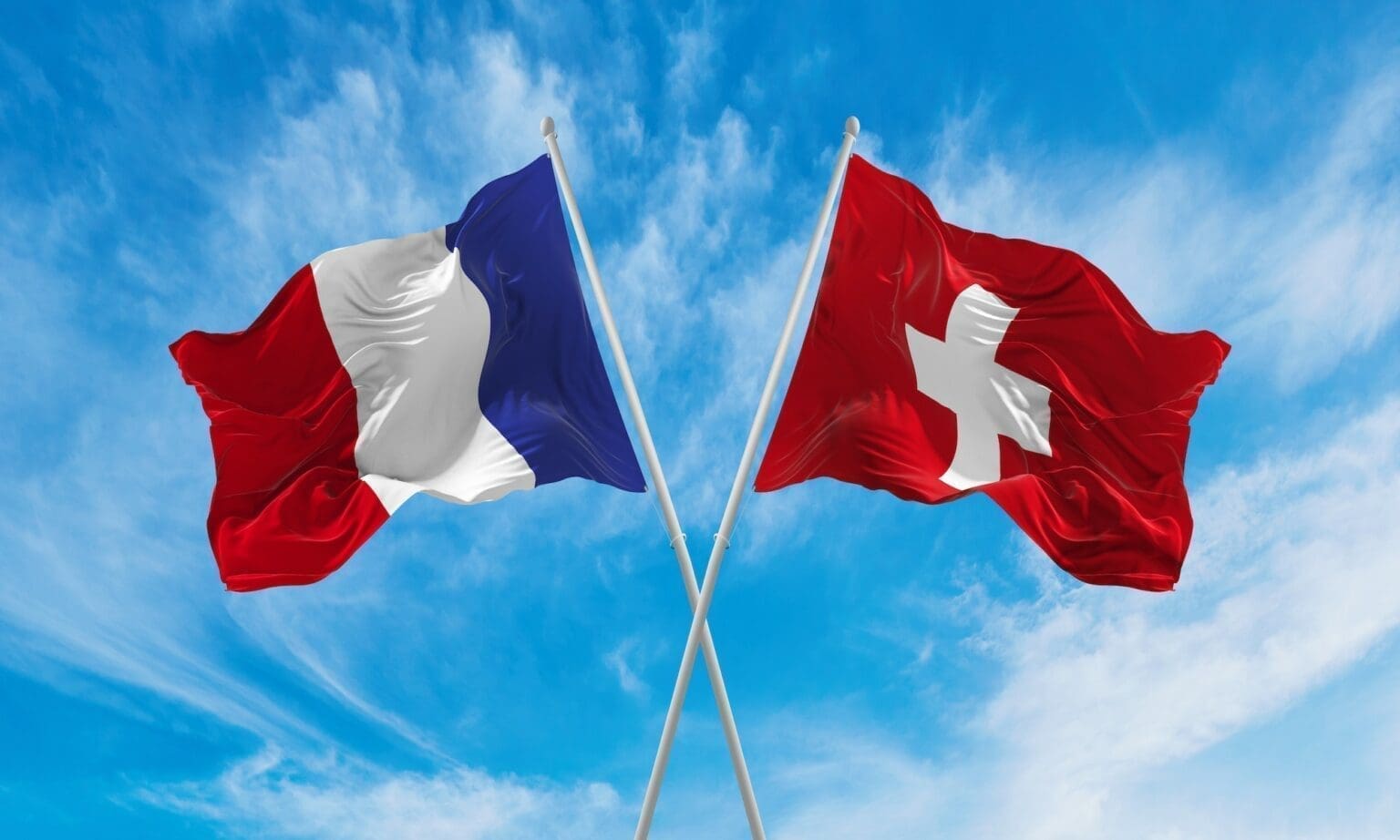 Crossed,National,Flags,Of,France,And,Switzerland,Flag,Waving,In
