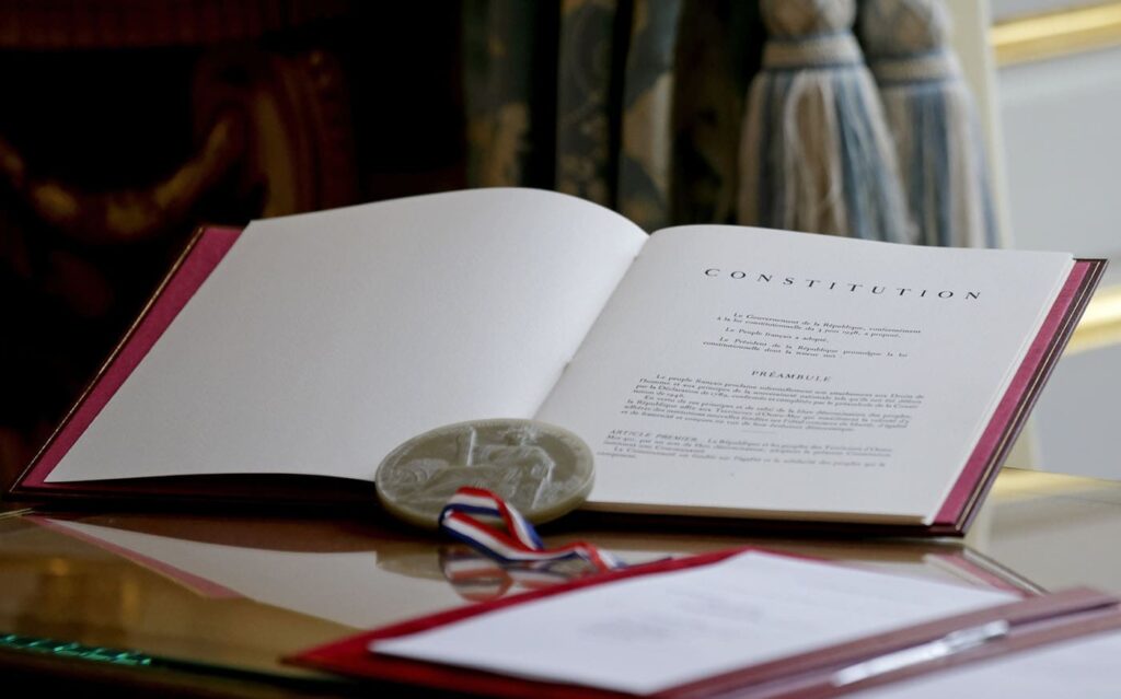 The French Constitution is seen during a ceremony at the Elysee Palace in Paris