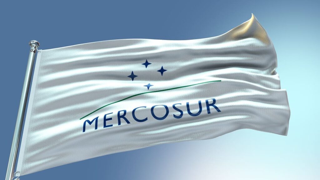 Mercosur waving flag  with texture in blue sky background