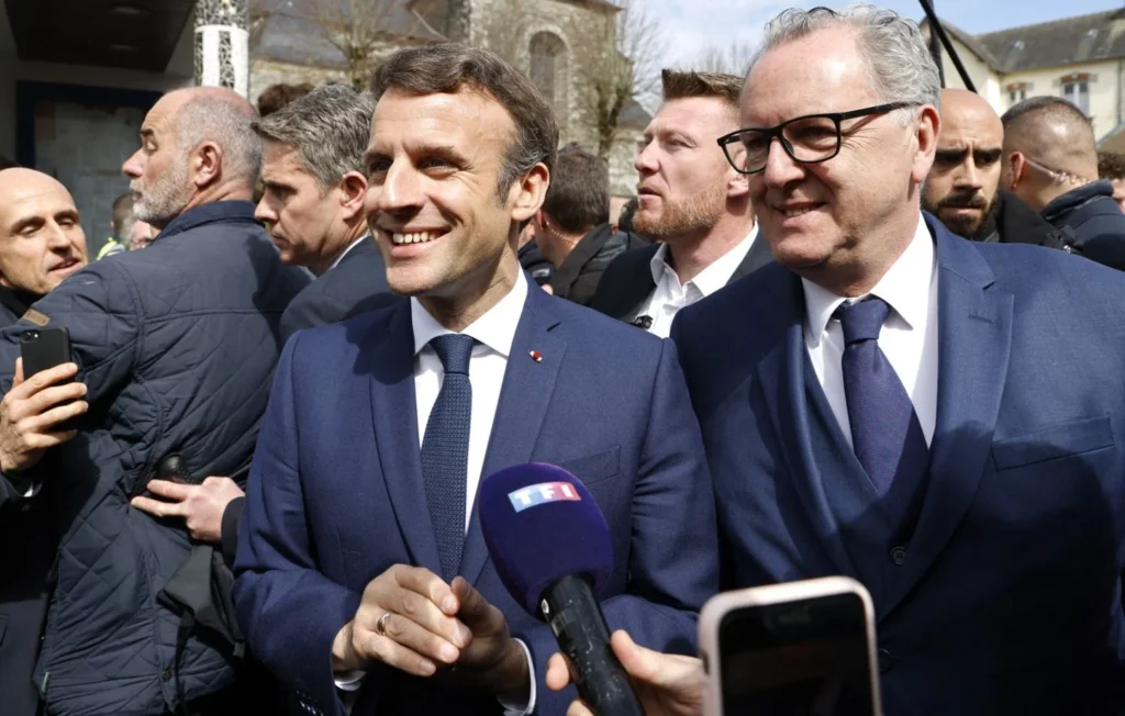 1444x920_french-president-and-liberal-party-la-republique-en-marche-lrem-candidate-for-re-election-emmanuel-macron-flanked-by-president-of-the-french-national-assembly-richard-ferrand-r-answers-journalists-during-a-campaign-visit-in-spezet