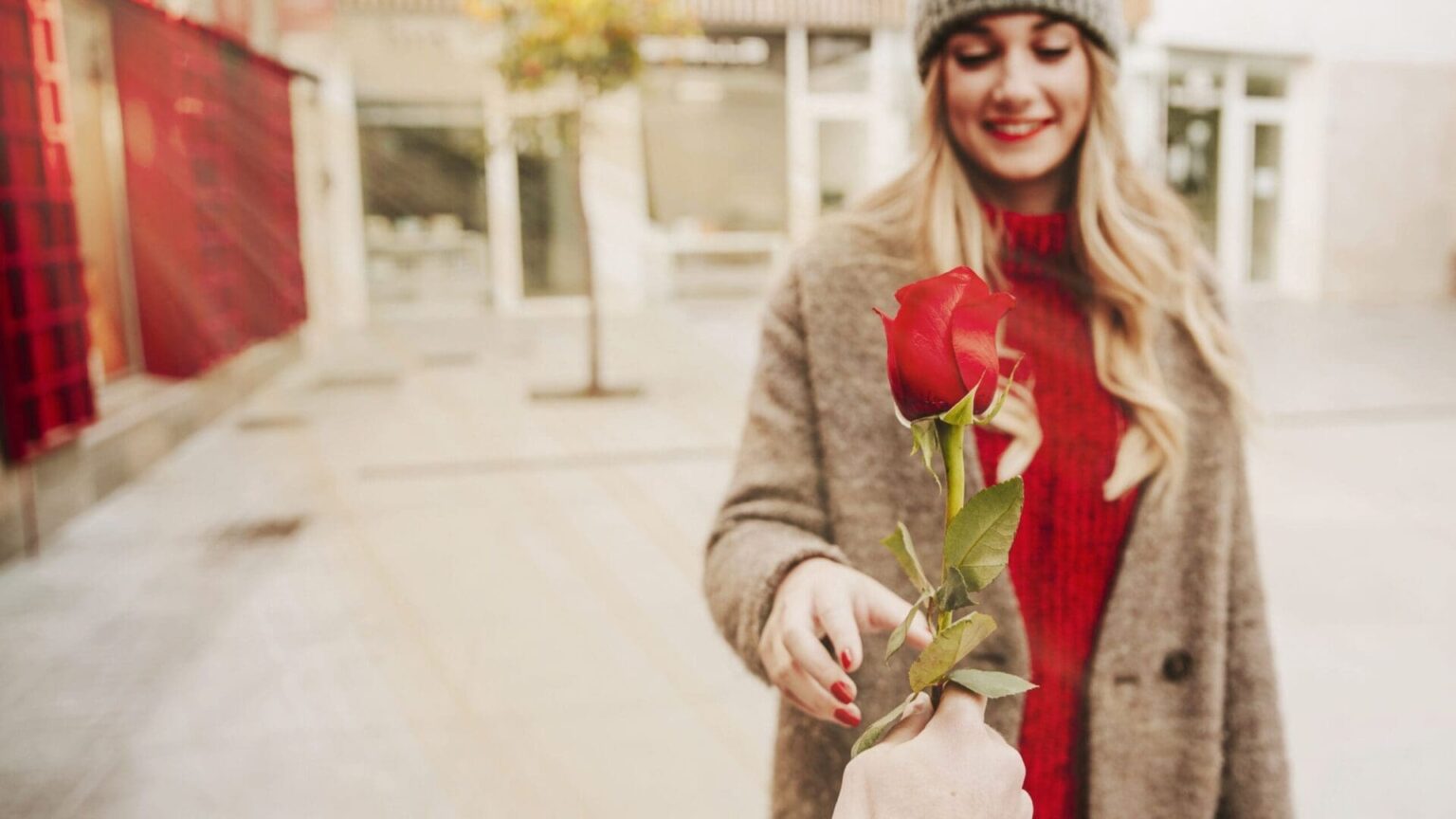 hand-giving-rose-woman