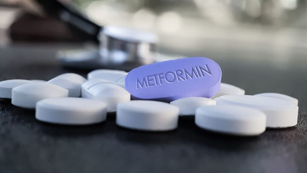 Blue,Metformin,Pill,On,Table,With,Stethoscope,And,Other,Tablets