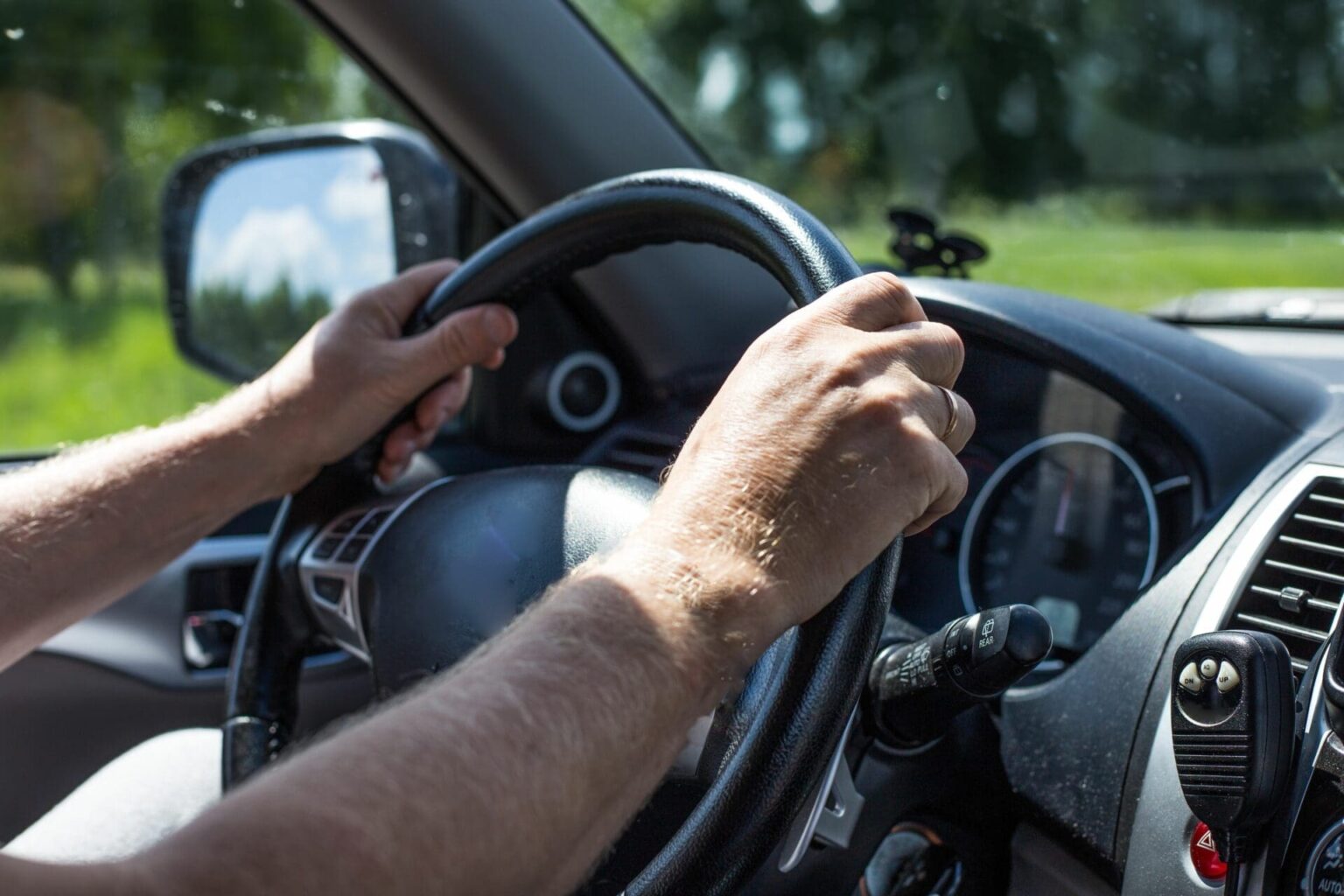 man driving a car