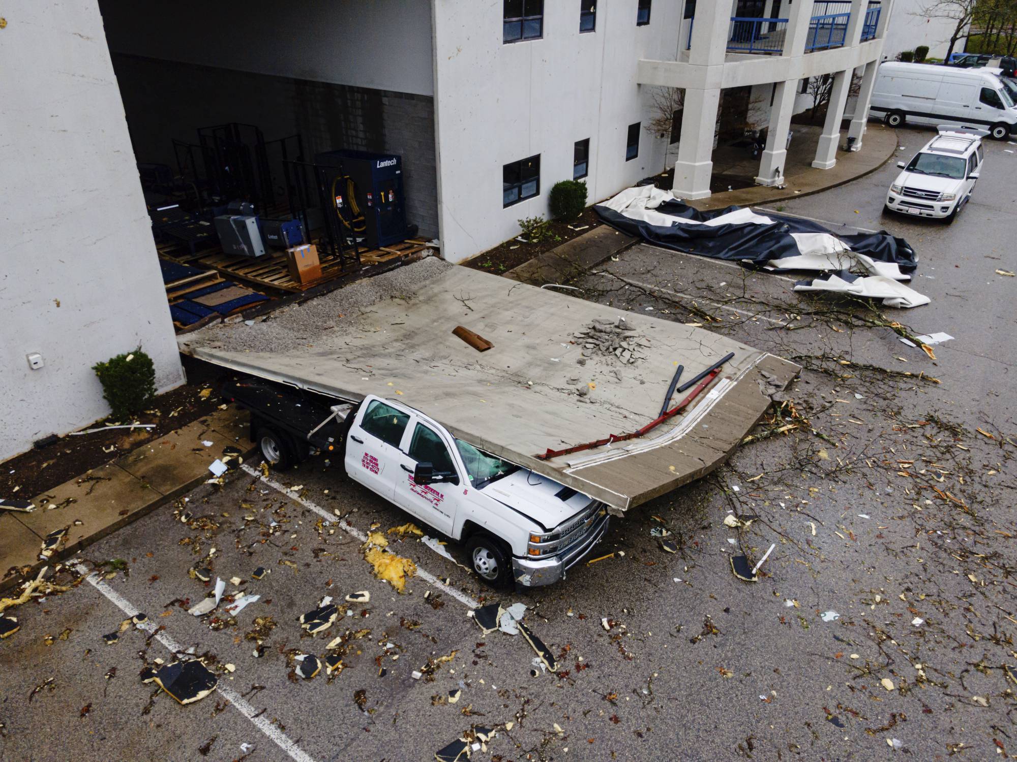 In An Aerial View, A Smashed Truck Sits Under A Section Of Collapsed Warehouse Wall After Violent Storms And Tornadoes Tore Through The Area On Thursday, April 3, 2025, In Jeffersontown, Ky. (Ap Photo/Jon Cherry) Ap Photo/Jon Cherry In An Aerial View, A Smashed Truck Sits Under A Section Of Collapsed Warehouse Wall After Violent Storms And Tornadoes Tore Through The Area On Thursday, April 3, 2025, In Jeffersontown, Ky. (Ap Photo/Jon Cherry) Ap Photo/Jon Cherry
