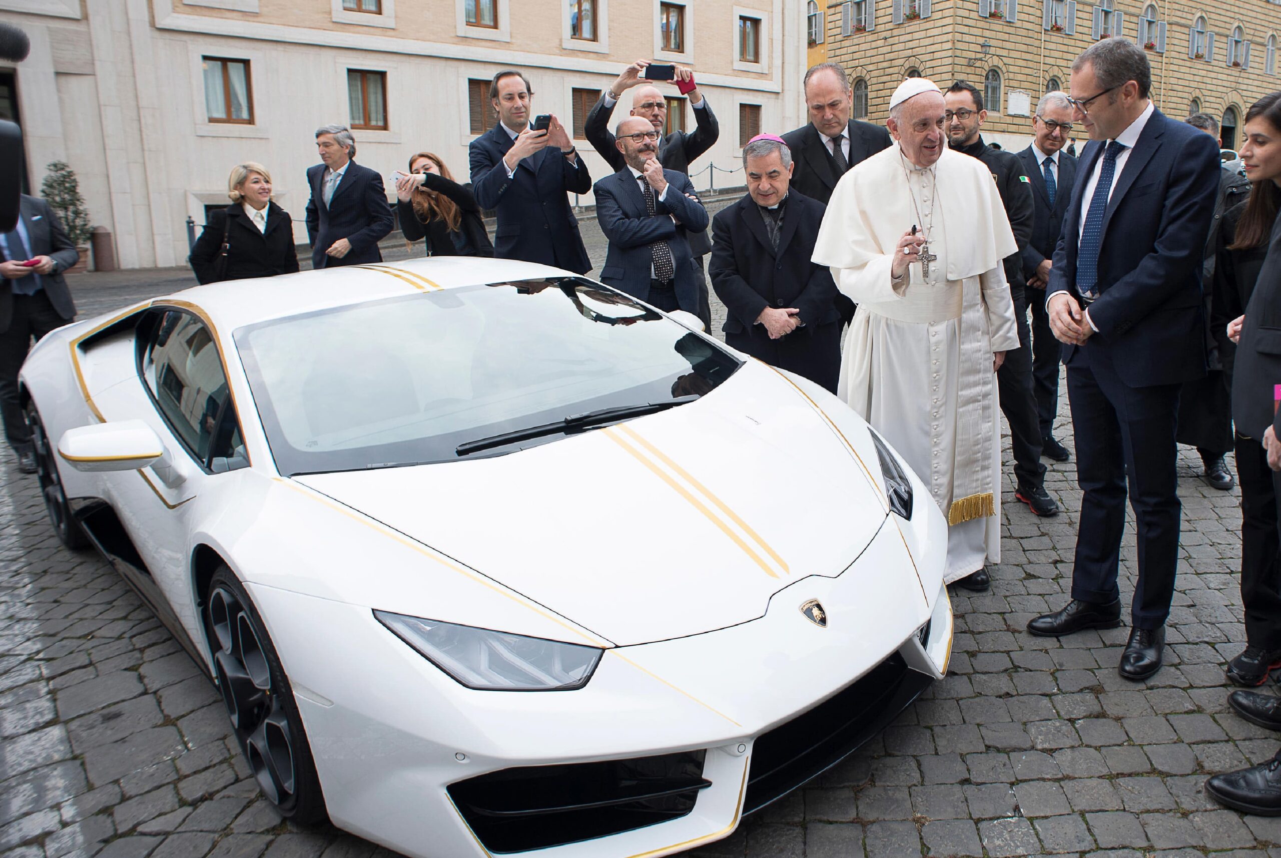 Pope Francis Speaks With Ceo Of Lamborghini Stefano Domenicali Next To A White Lamborghini Donated To The Pontiff By The Luxury Sports Car Maker, At The Vatican, Wednesday, Nov. 15, 2017. The Car Will Be Auctioned Off By Sotheby'S, With The Proceeds Going To Charities Including One Aimed At Helping Rebuild Christian Communities In Iraq That Were Devastated By The Islamic State Group. (L'Osservatore Romano/Pool Photo Via Ap) L'Osservatore Romano/Pool Photo Via Ap