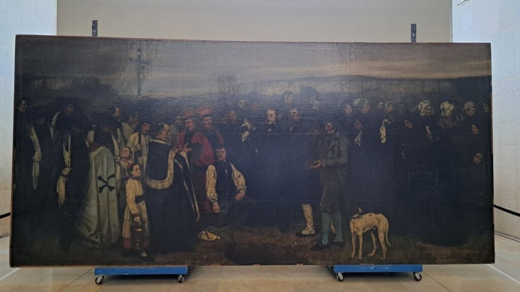 À Orsay, “Un enterrement à Ornans” de Courbet entame une spectaculaire renaissance sous les yeux du public