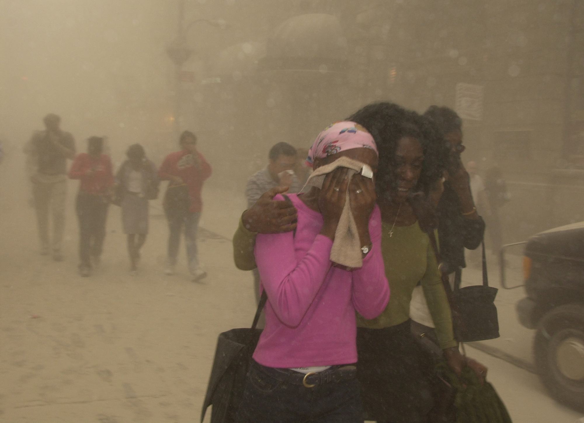 People Cover Their Faces As They Escape The Collapse Of The Twin Towers Of New York'S World Trade Center Following Terrorists Attacks, Sept. 11, 2001. (Ap Photo/Suzanne Plunkett) Ap Photo/Suzanne Plunkett