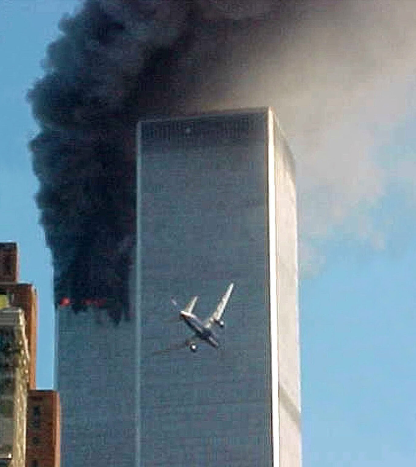 FILE- In this Sept. 11, 2001 file photo, American Airlines Flight 175 closes in on World Trade Center Tower 2 in New York, just before impact. Families of the victims of the worst terror attack on the United States in history gathered Wednesday, Sept. 11, 2013, to mark their 12th anniversary with a moment of silence and the reading of names. The Sept. 11, 2001 attacks in New York City and Washington killed almost 3,000 people and lead to a war in Afghanistan. (AP Photo/Carmen Taylor, File