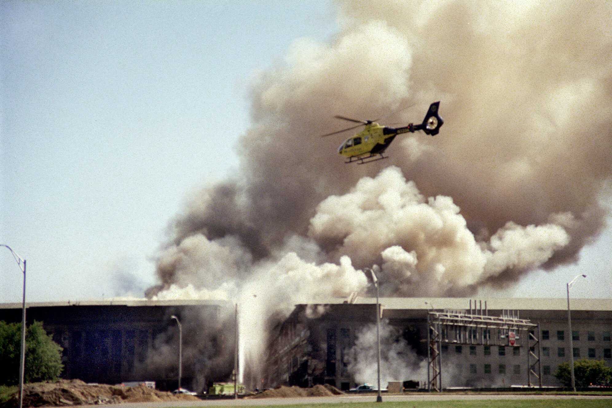 File - A Helicopter Flies Over The Pentagon In Washington As Smoke Billows Over The Building On Sept. 11, 2001, After A Hijacked Airliner Crashed Into The West Side Of The Building, Killing 184 People. Most Americans Were Guided Through The Events Of The Day By One Of Three Men: Tom Brokaw Of Nbc News, Peter Jennings Of Abc And Dan Rather Of Cbs. Each Had Extensive Reporting Experience Before That, Brokaw And Rather Were At The White House During Watergate, And Jennings Has Been A Foreign Correspondent. (Ap Photo/Heesoon Yim, File) Ap Photo/Heesoon Yim, File