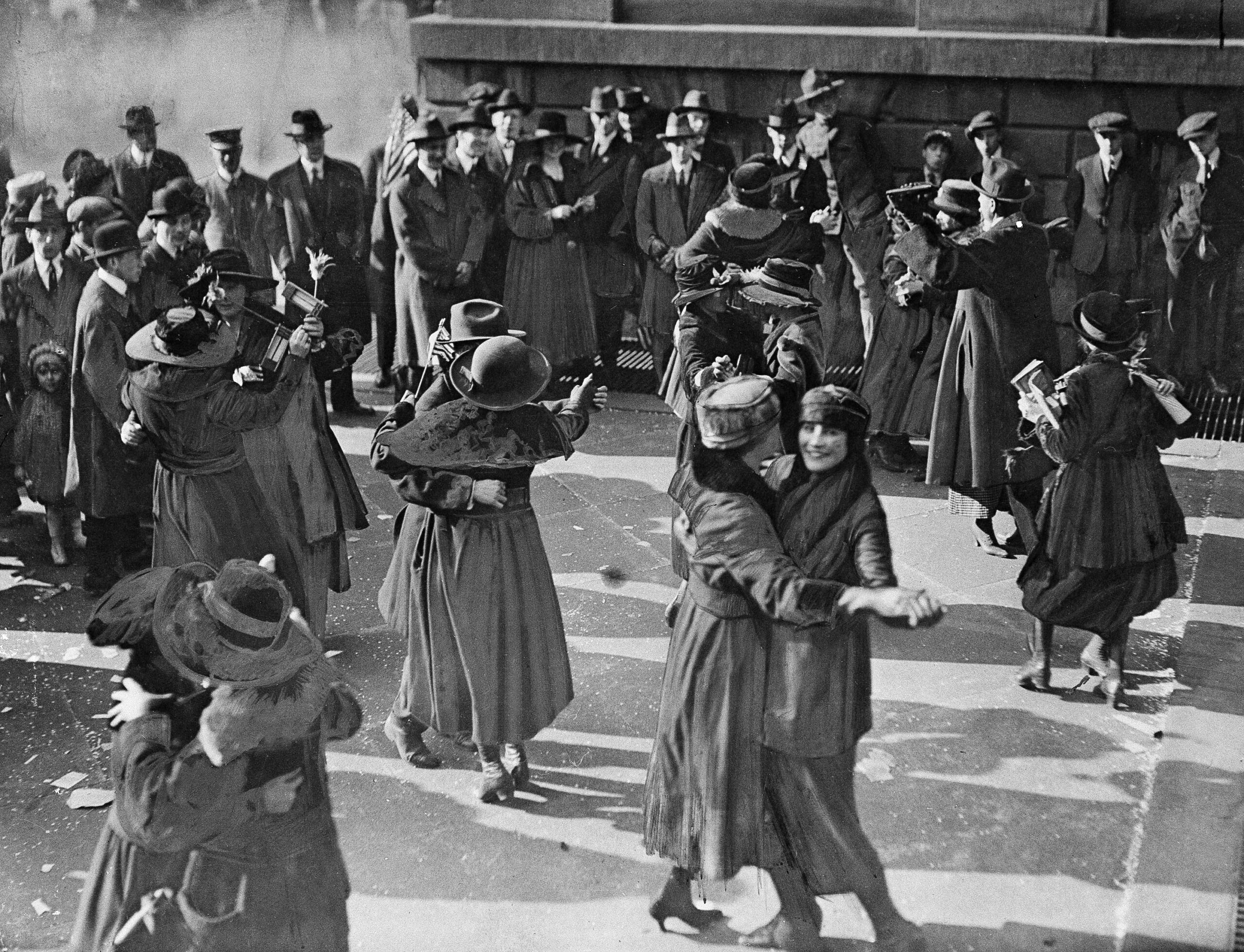 Women Dance In The Street Below The Window Of The Mayor'S Office At City Hall In New York On Armistice Day, Nov. 11, 1918. (Ap Photo) Ap Photo