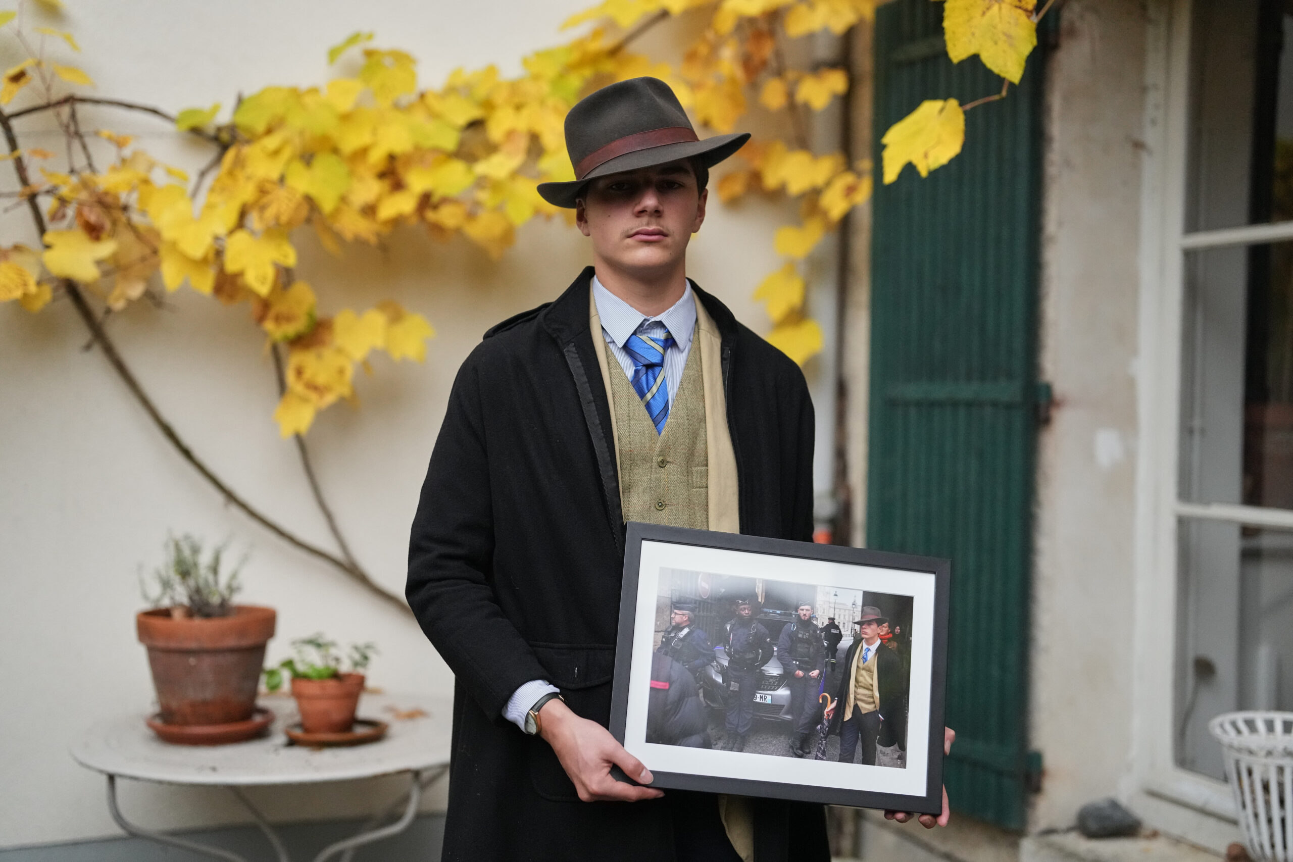 Pedro Elias Garzon Delvaux Poses With An Associated Press Photo Of Him Outside The Louvre On The Day Of The Crown Jewels Heist, Saturday, Nov. 8, 2025, In Rambouillet, South Of Paris. (Ap Photo/Thibault Camus) Ap Photo/Thibault Camus