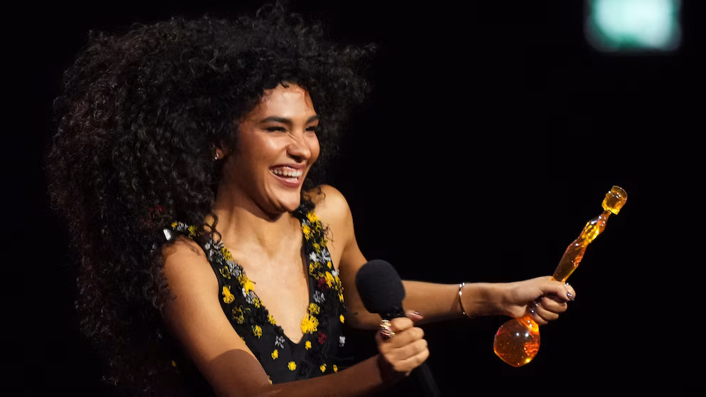 Olivia Dean triumphed at the Brit Awards with four trophies, including Artist of the Year and Song of the Year.