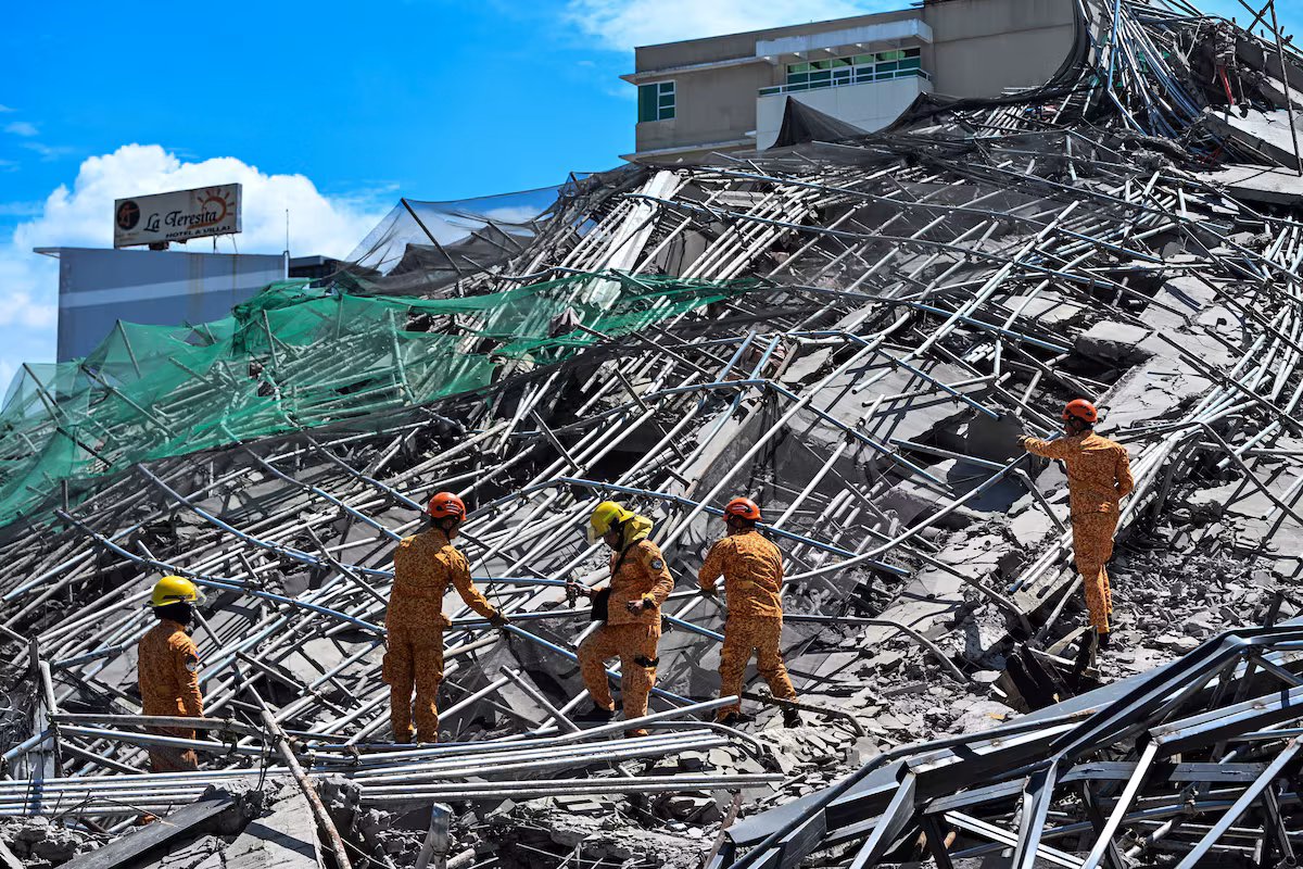 Race against time in the Philippines: more than 20 people trapped after a building collapses