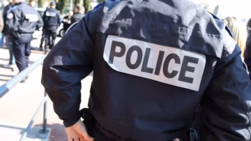 A woman was found dead in her bathtub in Paris; her partner is being actively sought.